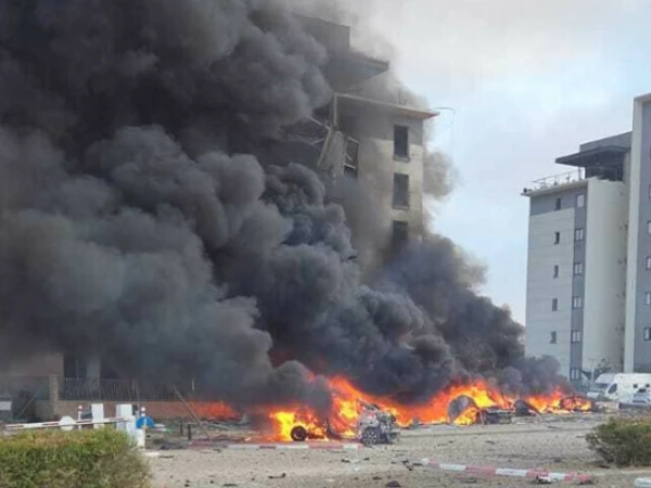 An Iranian missile hit a residential area, causing damage to nearby buildings, vehicles, and infrastructure.